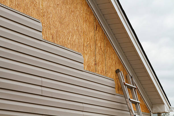 Professional Siding Replacement technician working in Wye Mills, MD
